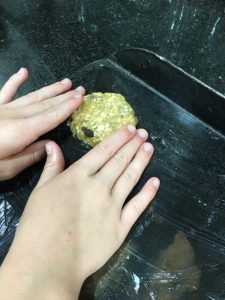 Buzymum - Kids helping shape the mix and place on a baking sheet