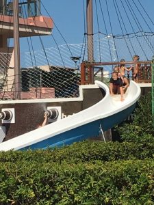 Buzymum - Lou sliding down from the pirate ship