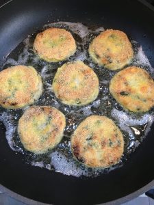 Buzymum - Salmon fishcakes shallow frying on their second side
