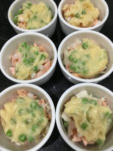 Buzymum - Adding sauce to the fish for the pies