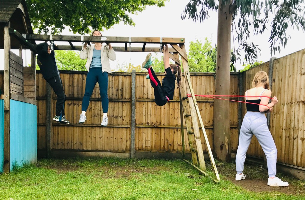 Buzymum- family using a climbing frame for fitness